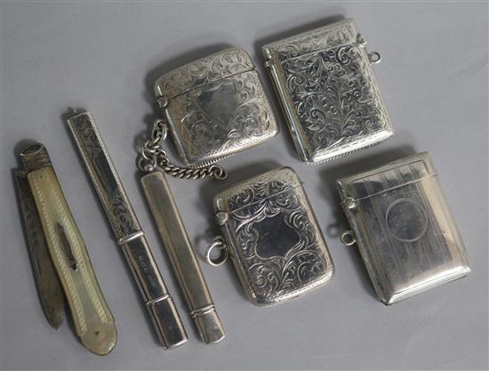 Four early 20th century engraved silver vesta cases, two silver pencil holders and a Victorian silver and fruit knife.